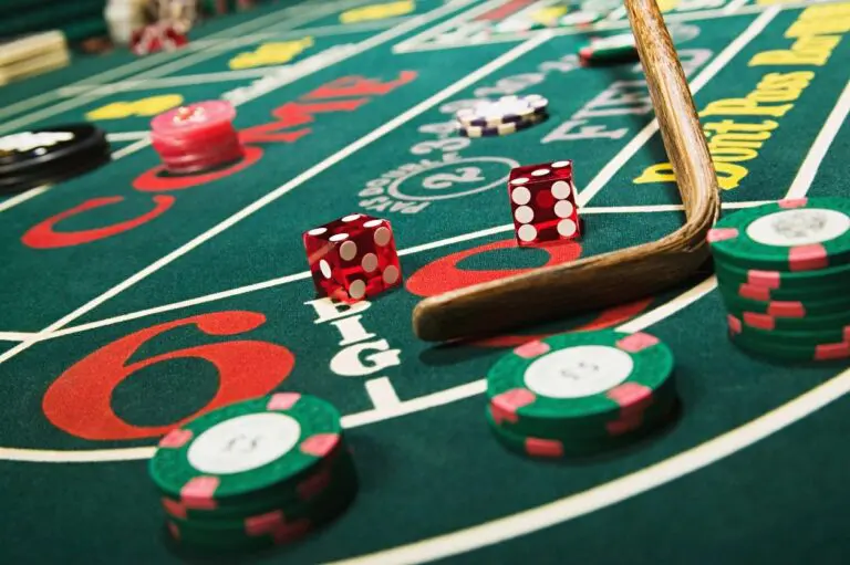 A table with dice and chips on it.