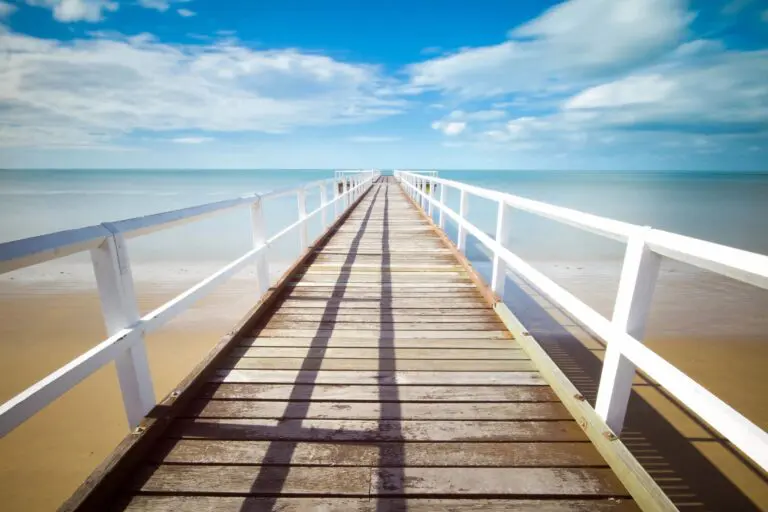 A boardwalk that is going over the water.