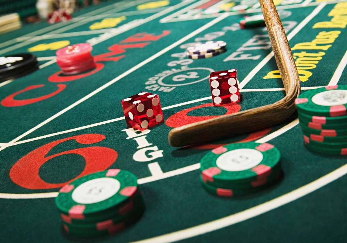 A table with dice and chips on it.