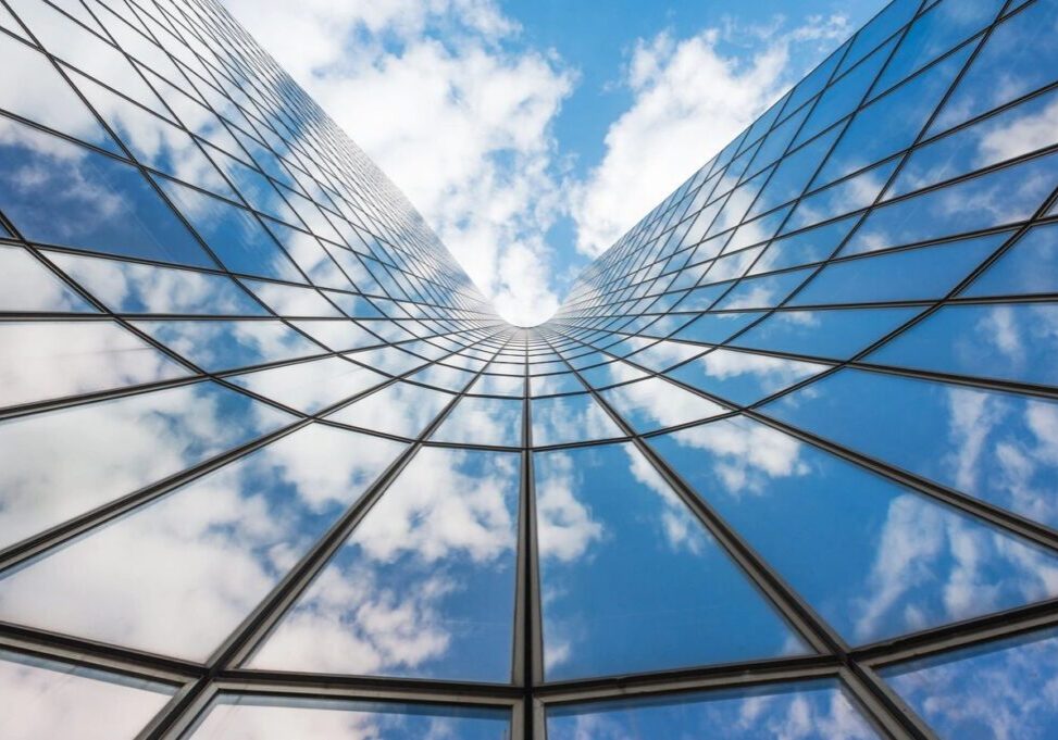 A view of the sky through an office building.